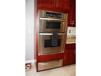 Kitchen. the backspash and hood add to the uniquen