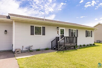 Ranch-style home featuring a front yard and centra