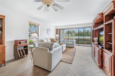 Living room with ceiling fan, plenty of natural li