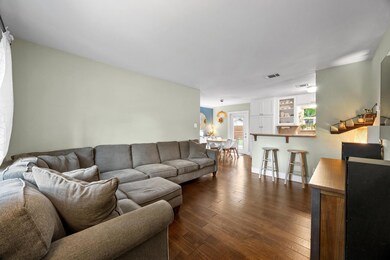 Living area with dark wood-style flooring