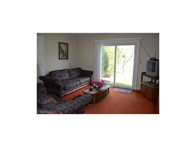 Family room with newer slider to fenced rear yard.