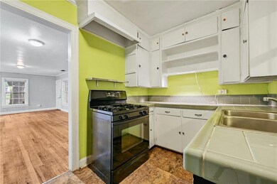 Kitchen featuring black range with gas stovetop, 