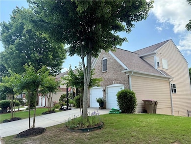 View of property exterior with concrete driveway, a lawn, and a shingled roof