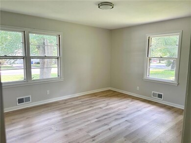 Empty room featuring healthy amount of natural light and light wood-style floors