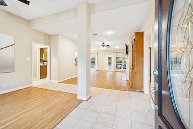 As you enter, you are greeted by the formal dining room and family room behind. This open concept living is perfect for entertaining.