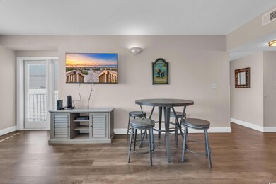 Dining space with baseboards and wood finished floors