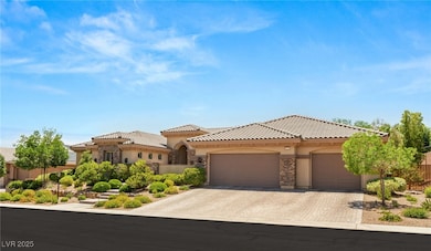 View of front facade featuring stucco siding, a ti