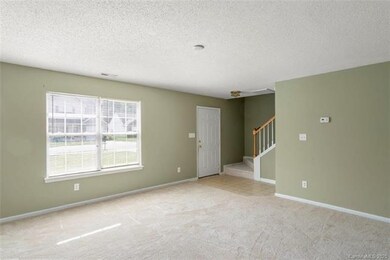 LIVING ROOM: The living room is accented by a larg