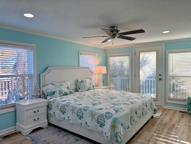 Bedroom with ceiling fan, light hardwood / wood-st