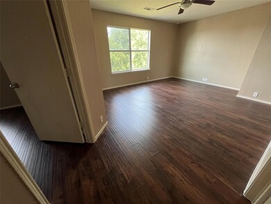 Empty room with ceiling fan and hardwood / wood-st