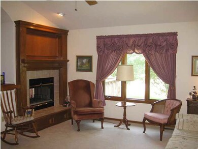 Inviting living room with see-through fireplace to