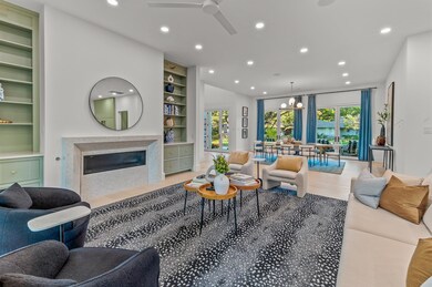 Living room with light hardwood / wood-style floor
