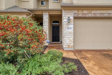 Property entrance featuring stone siding and stuc