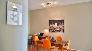 Dining room with track lighting and hardwood / woo