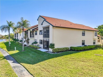 View of property exterior with stucco siding, a yard, and a shingled roof