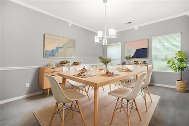 Dining area featuring crown molding, baseboards, a