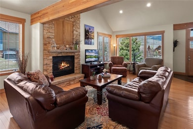 Great room featuring recessed lighting, a stone fi