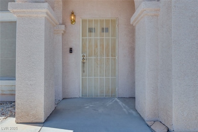 View of exterior entry featuring stucco siding