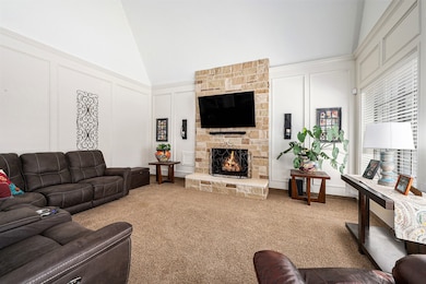 Comfortable family room offers a high ceiling, plu