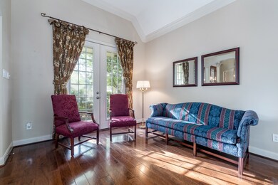 This room has high ceilings with crown molding and double French doors that lead you to the front porch!