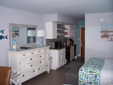 Kitchen featuring sink, decorative backsplash, and