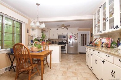 Kitchen and breakfast nook with built in cabinets.