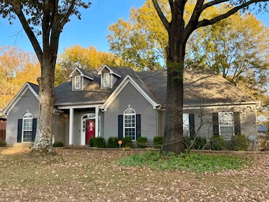 Cape cod house with brick siding