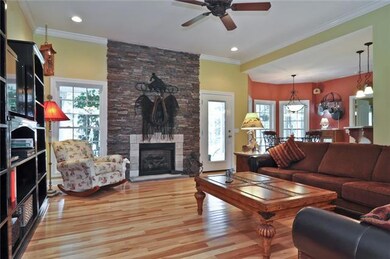 Open floor plan gives a welcoming view of the fire place and great room from the foyer.
