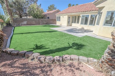 View of yard with a fenced backyard and a patio