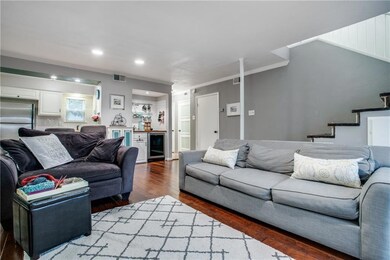 Opens to kitchen and offers a wet bar plus beverag