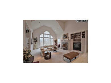 Two-story great room has beautiful windows to the 