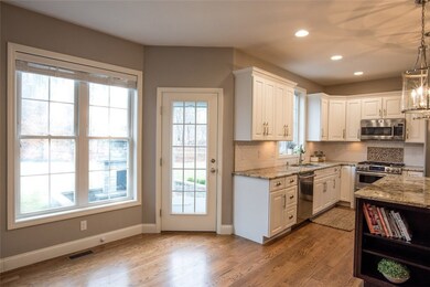 OPEN KITCHEN LEADING OUT TO PAVER PATIO
