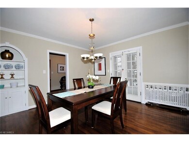Dining room with built-ins, crown molding and Fren