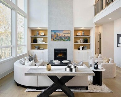 Living room featuring built in features, a tiled f