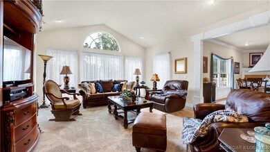 Living area offers beautiful wall of cathedral win