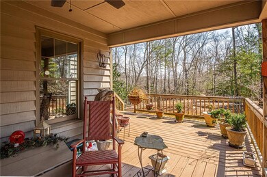 Wooden deck featuring a porch and ceiling fan