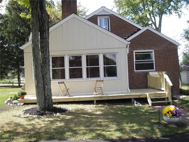 VIEW OF SIDE OF HOUSE WITH NEW DECK