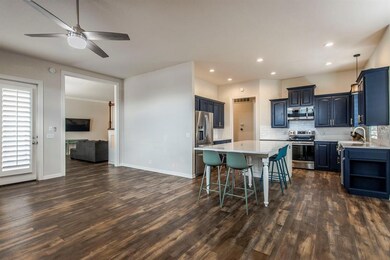 Kitchen featuring a breakfast bar, dark wood-type 