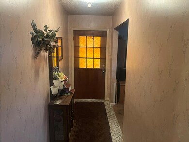 Entryway with a textured ceiling