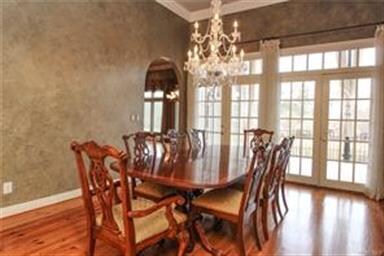Handsome heart pine floors, a beautiful crystal ch