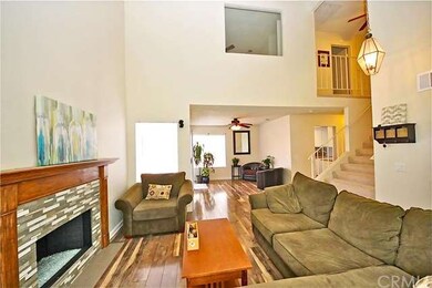 Large fireplace with wood mantle, glass tile mosai