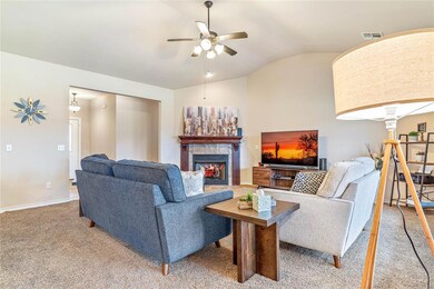 Living room with lofted ceiling, ornate columns, c