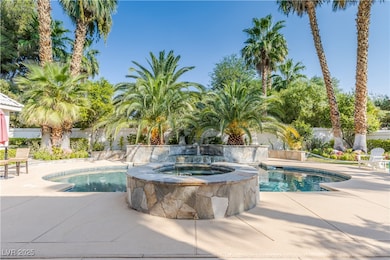 View of swimming pool with a fenced in pool, a pat
