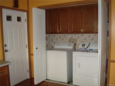 Utility area with additional cabinetry.