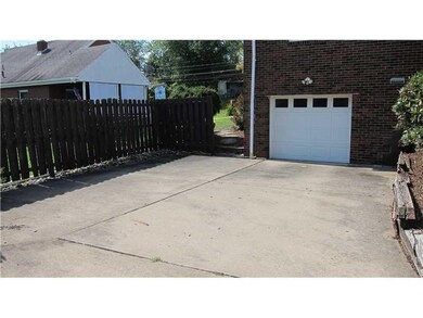 Exterior Back. Large driveway for guest parking, a