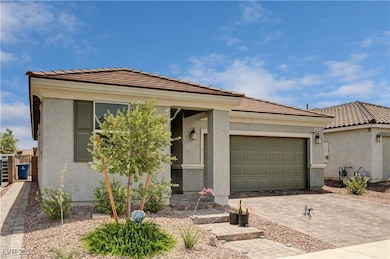 View of front of property featuring an attached ga