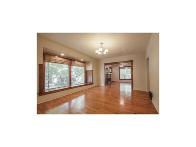 Dining room with window seat opens to kitchen