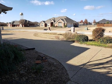 View of yard with a residential view and a garage
