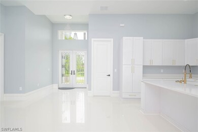 Kitchen featuring light tile patterned flooring, w