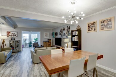 View of the dining room, living room and entry int